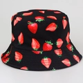 Reversible bucket hat featuring black fabric and vibrant red strawberry pattern - M / Black Strawberry