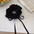 Elegant black lace scrunchie with long ribbon bow on a clean white surface - Lace Streamer Style / Black