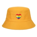 A stylish yellow bucket hat featuring detailed rainbow heart embroidery on front - Yellow