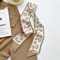 Narrow silk scarf in beige with brown smiley face pattern and smiley text print - Khaki Smile Face