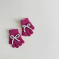 Detail of rose red knit gloves featuring light blue bow decor and soft plush texture - Approx. 2-6 Years Old / Rose Purple