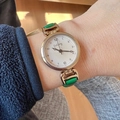 GoGoey minimalist quartz watch featuring a small white dial and emerald green leather strap - Green