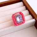 Macro detail of a vintage resin hexagonal ring with inset purple rhinestone in a gift box - Pink & Light Purple