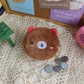 Close-up of a brown plush bear coin purse with metal zipper and bead chain attachment - Dotted Ear Bear
