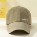 Close-up detail of 'mama' embroidery on washed cotton baseball cap fabric texture - One Size / Khaki