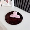 Pink plush hair claw clip for women on a wooden tray with a minimalist aesthetic style - Light Pink + Lotus Pink