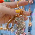 Sparkling crystal bear keychain with champagne rhinestones and brown leather strap - Mixed Coffee