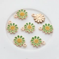 Detail of small daisy alloy charms with green enamel petals and golden hanging loops - Green