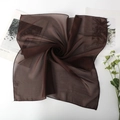 Deep coffee brown semi-transparent chiffon square scarf in elegant spiral arrangement - Coffee