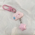 Detail of pink resin cloud keychain with star pendant on a white textured background - Pink Expression Cloud Star / Pink