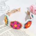 Detail of handmade knit floral headband with colorful 3D crochet flowers on white wool - Wave White Colorful Series