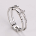 Macro view of silver stainless steel double layer ring with hollow cross and pavé crystals - US 5 / Steel