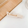 Elegant gold finish pearl hair clip with crown arrangement on white and wood surface - Crown Pearl Duckbill Clip