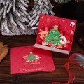 3D pop-up Christmas card with reindeer, Santa, and tree inside a red festive envelope - Christmas Tree