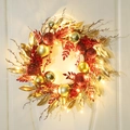 Christmas wreath with red and gold ornaments and warm LED lights on a white wall - Red & Gold Wreath (With Light)