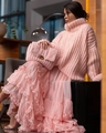 Pink chunky turtleneck knit sweater paired with tiered ruffle skirt and faux fur clutch - S / Pink