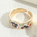 Bague réglable dorée avec motif floral en émail coloré et accents de zircon - Fleur Noire (JZ0254)