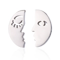 Macro view of minimalist hollow face stud earrings with polished silver metal finish - Silver