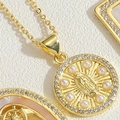 Macro view of gold pendant with Virgin Mary relief, pearls and sparkling zircons - Round Pearl Virgin Mary