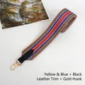 Close-up of woven bag strap with yellow-blue pattern, black leather ends and gold hooks - Yellow Blue with Black Trim