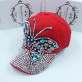 Red denim baseball cap featuring a large colorful rhinestone butterfly embellishment - Adult Size (Adjustable) / Red