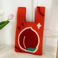 Red knitted tote bag featuring a large peach jacquard pattern and double handles - Orange Peach