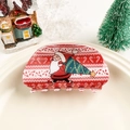 Gros plan sur une pince à cheveux de Noël rouge avec motifs Père Noël et sapin - Demi-cercle - Père Noël Rouge Blanc