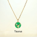 Luxurious gold Taurus zodiac necklace with green enamel and sparkling crystal accents - Taurus