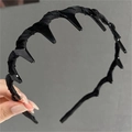 Cerchietto in tessuto nero intrecciato con denti lucidi per acconciature stabili - Nero