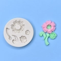 Close-up of silicone mold with flower and leaf shapes next to pink clay art - Multi-Hole Flower Leaf Style (2)