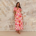 Close-up of floral backless maxi dress with side cut-outs and V-neckline detail - S / White with Red Floral