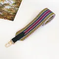 Detail of bohemian woven bag strap in yellow and green with gold metal swivel hook - Yellow Green with Green Trim