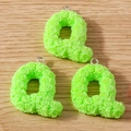 Macro detail of three green Q-shaped resin charms with rose texture and metal rings - Letter Q / 10 Pieces Pack / Light Green