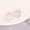 Detail of square zircon stud earrings with gold plating on elegant purple silk fabric - 5# White Stud Earrings