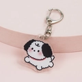 Cute acrylic keychain featuring a white puppy with black ears and a pink background - Walking Dog