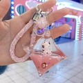 Dettaglio portachiavi con sabbie mobili rosa, figura di tigre e stelle glitter - Corda di Diamante + Perline / Caramella