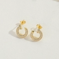 Minimalist gold-plated hoop earrings with pavé-set zircons on a white textured background - Hollow Gold Round