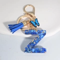 Royal blue resin letter Z keychain with tassel and butterfly charm in gold finish - Letter Z
