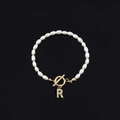 Elegant white oval pearl bracelet with a golden T-bar clasp and rhinestone letter R charm - Gold Letter R (SL2013)
