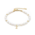Close-up of pearl bracelet featuring a gold letter Z pendant with micro zircons - Letter Z