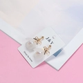 Detail of white resin flower earrings with gold bow and pearl on brand display card - Bow 3D Flower Artificial Pearl Style (E1486-1/Earring Post)