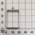 Silver rectangular alloy frame pendant for DIY resin jewelry on a metric grid paper - Small Rectangle (10474) / 21x30mm / White K/Silver