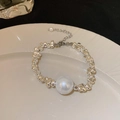 Silver beaded bracelet with center large pearl and small pearl charm on ceramic plate - Silver Large Pearl Crushed Silver Bracelet (13#)