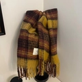 Close-up of thick plaid scarf featuring red and yellow checks with tassel fringe detail - British Plaid Ginger