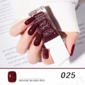 Quick-dry peelable nail polish in 025 bovine blood red shown on elegant hand model - 25#Bovine Blood Red