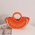 Orange semi-circle straw handbag with woven texture and white drawstring closure - Orange