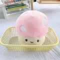 Detailed view of a soft pink plush mushroom toy with white dots and embroidered smile face - Pink