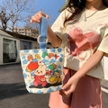 Cream canvas bucket bag with colorful HAPPY print and blue wooden ring handles - Coco Rabbit