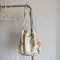 Close-up of minimalist cotton tote bag with abstract ink wash marble pattern print - Adjustable Single Strap Crossbody Bag