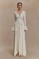 Detailed close-up of delicate lace splicing on a white V-neck dress with flared sleeves - S / White